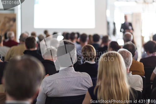 Image of Business speaker giving a talk at business conference event.