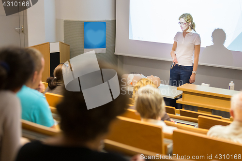 Image of Instructor teaching first aid cardiopulmonary resuscitation workshop.