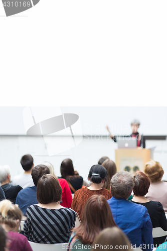 Image of Woman giving presentation on business conference.