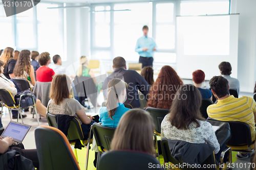 Image of Speaker giving presentation on business conference.