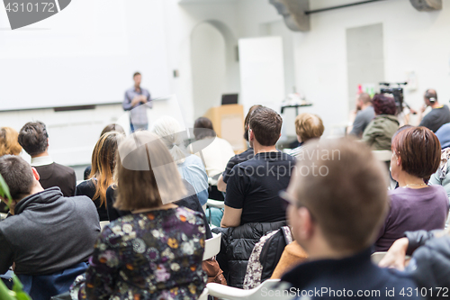 Image of Man giving presentation in lecture hall at university.