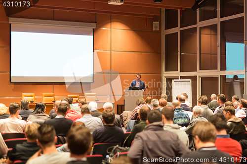 Image of Business speaker giving a talk at business conference event.