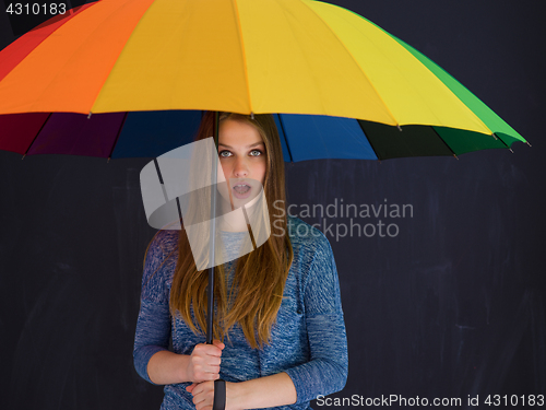 Image of handsome woman with a colorful umbrella