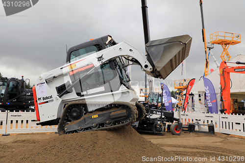 Image of Operating Bobcat on Sand Work Site