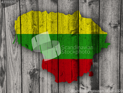 Image of Map and flag of Lithuania on weathered wood