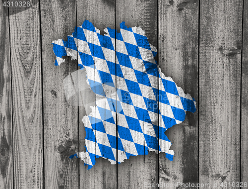 Image of Map and flag of Bavaria on weathered wood