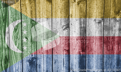 Image of Flag of the Comoros on weathered wood