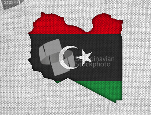 Image of Map and flag of Libya on old linen