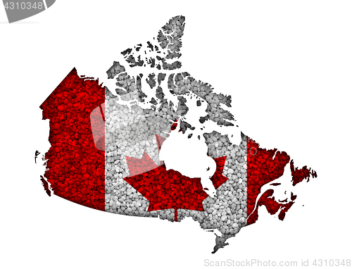 Image of Map and flag of Canada on poppy seeds