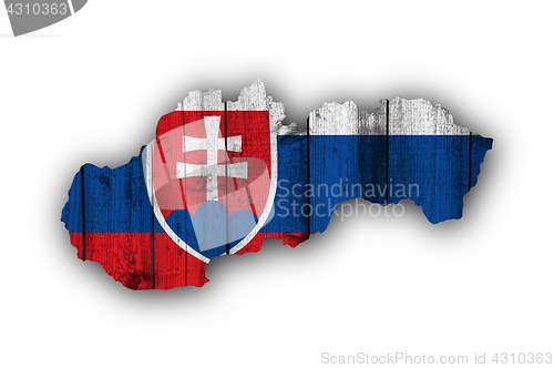 Image of Map and flag of Slovakia on weathered wood