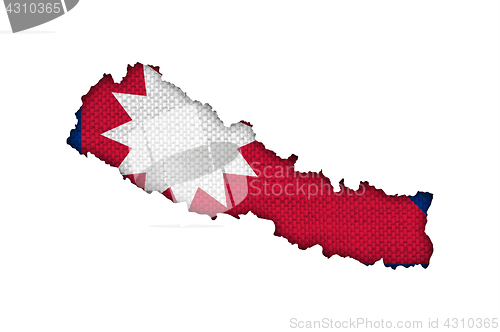 Image of Map and flag of Nepal on old linen