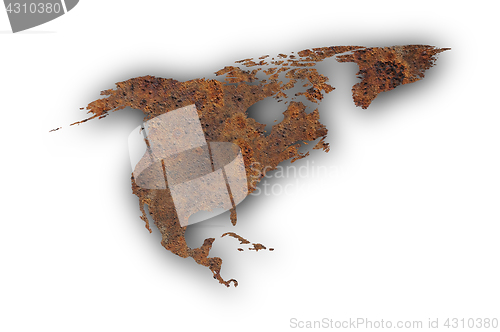 Image of Map of North America on rusty metal