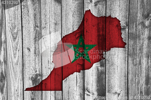 Image of Map and flag of Morocco on weathered wood