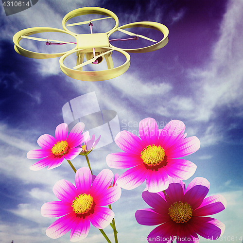 Image of Drone, quadrocopter, with photo camera against the sky and Beaut