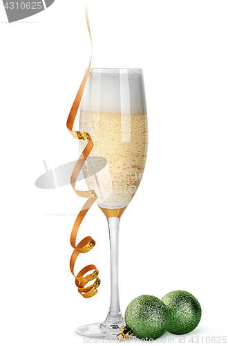 Image of Glass of champagne and Christmas balls