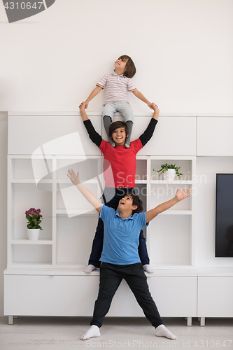 Image of young boys posing line up piggyback