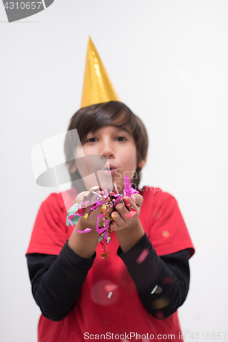 Image of kid blowing confetti