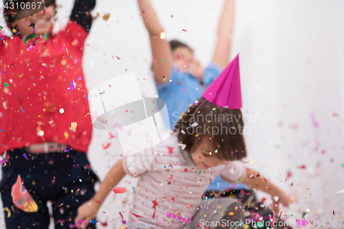 Image of kids  blowing confetti