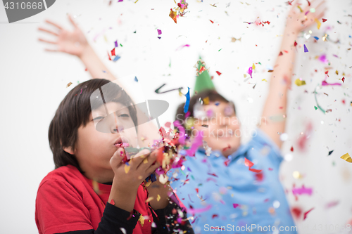 Image of kids  blowing confetti