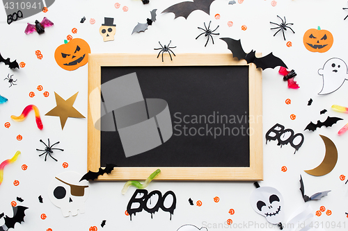 Image of blank chalkboard and halloween party decorations