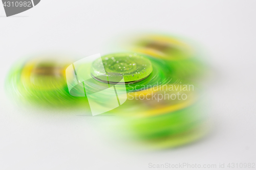 Image of close up of lime green spinning fidget spinner