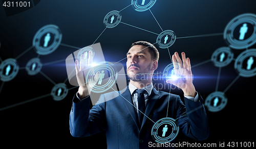 Image of businessman with virtual network contacts