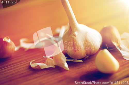 Image of close up of garlic on wooden table