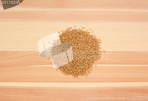 Image of Fenugreek seeds on wood