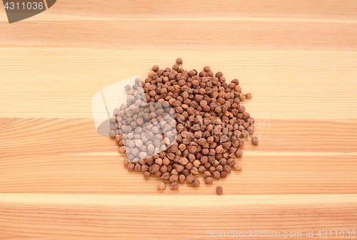 Image of Black chickpeas on wood