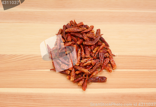 Image of Birds eye chillis on wood