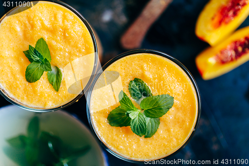 Image of Orange smoothie with leaves of fresh mint