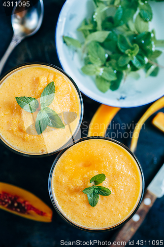 Image of Orange smoothie with leaves of fresh mint