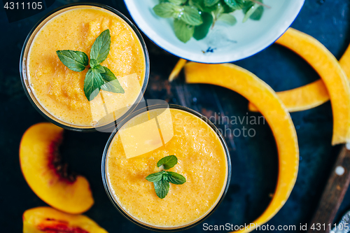 Image of Orange smoothie with leaves of fresh mint