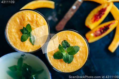 Image of Orange smoothie with leaves of fresh mint