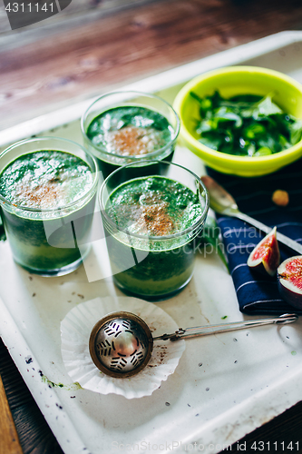 Image of Green smoothies with leaves of fresh mint