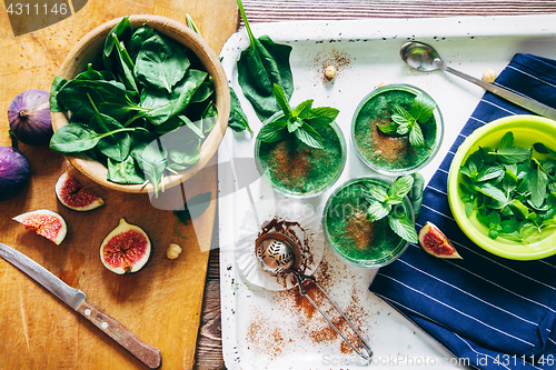 Image of Green smoothies with leaves of fresh mint