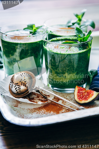 Image of Green smoothies with leaves of fresh mint