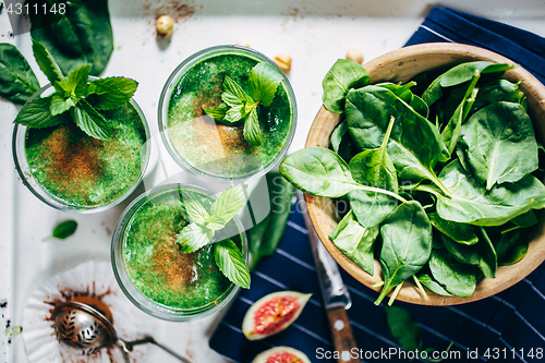 Image of Green smoothies with leaves of fresh mint