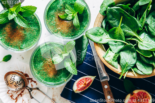 Image of Green smoothies with leaves of fresh mint