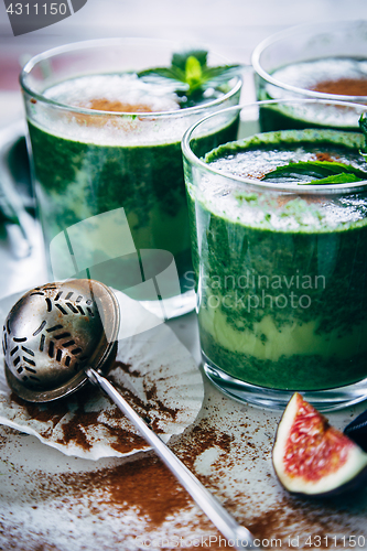 Image of Green smoothies with leaves of fresh mint