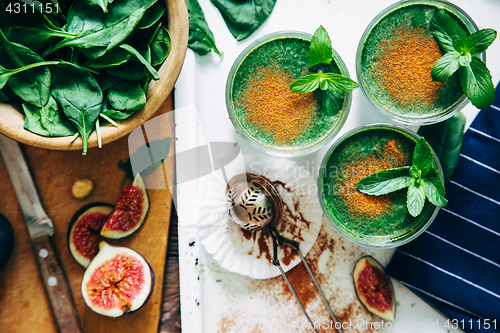 Image of Green smoothies with leaves of fresh mint