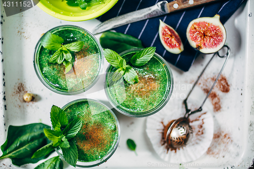 Image of Green smoothies with leaves of fresh mint