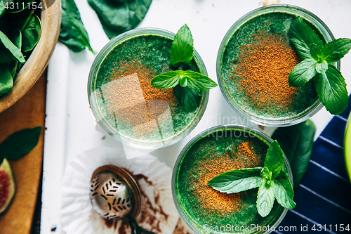 Image of Green smoothies with leaves of fresh mint