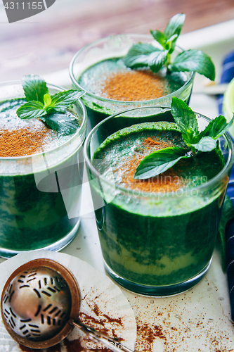 Image of Green smoothies with leaves of fresh mint