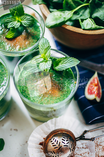 Image of Green smoothies with leaves of fresh mint