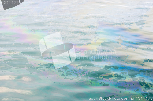 Image of colrful oil slick on the water