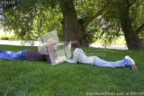 Image of Young couple looking at each other at the Park