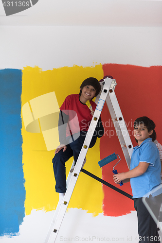 Image of boys painting wall