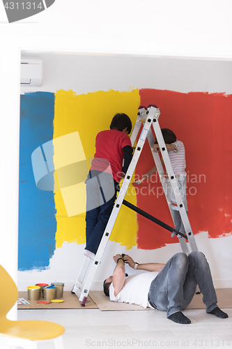 Image of boys painting wall