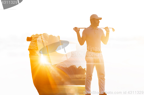 Image of Double exposure of senior golf player